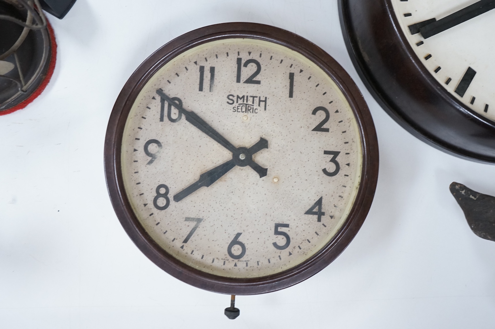 Two 20th century electric wall clocks, including a Smith’s Bakelite example, largest 47cm diameter